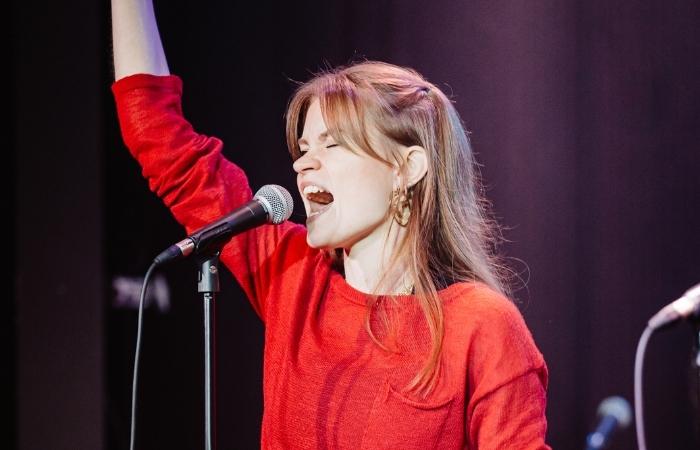 femal singer with an open jaw for hitting a high note