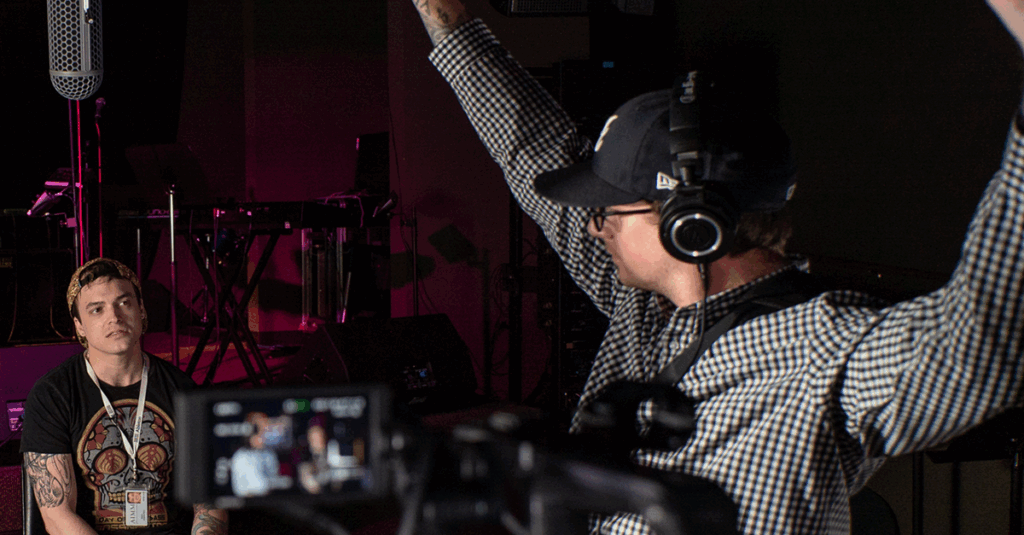 Person holding a boom pole