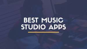 Producer using a music studio app on a tablet with a MIDI keyboard and microphone